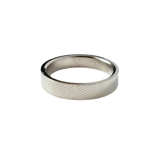 Thin stainless steel band with diagonal stripe embossed all the way around.
