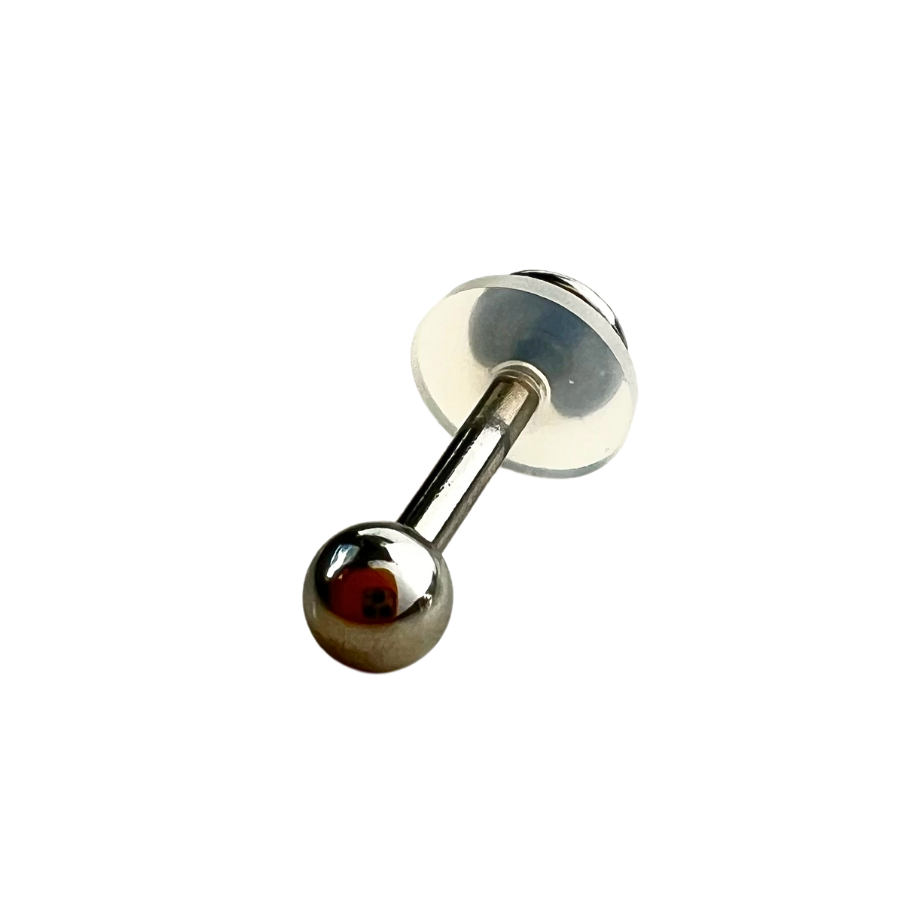 Medical Grade Silicone Disc shown on the back of a labret.