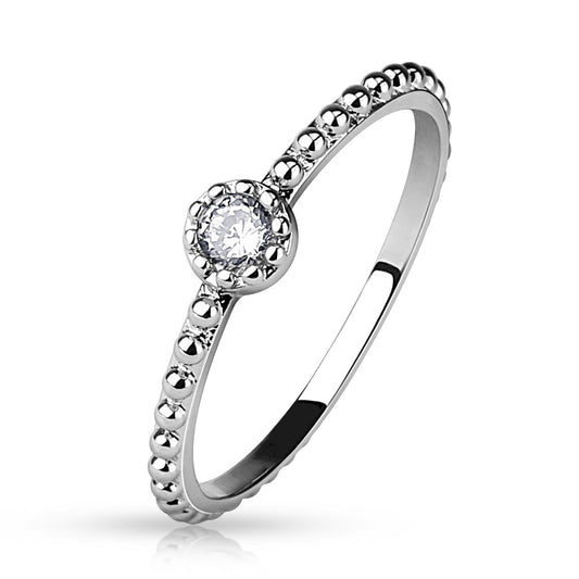 Dainty stainless steel band ring with a single clear gem.
