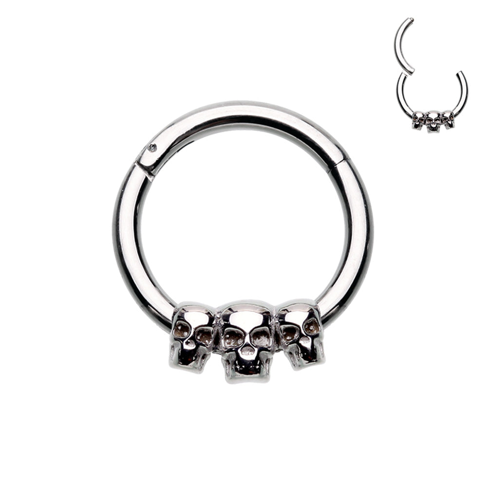 316L Surgical steel hinged segment ring with 3 small skulls in steel. Great for septum or cartilage. These hinged clickers can be used for eyebrow, lip, earlobes, daith, rook, snug, helix or septum.