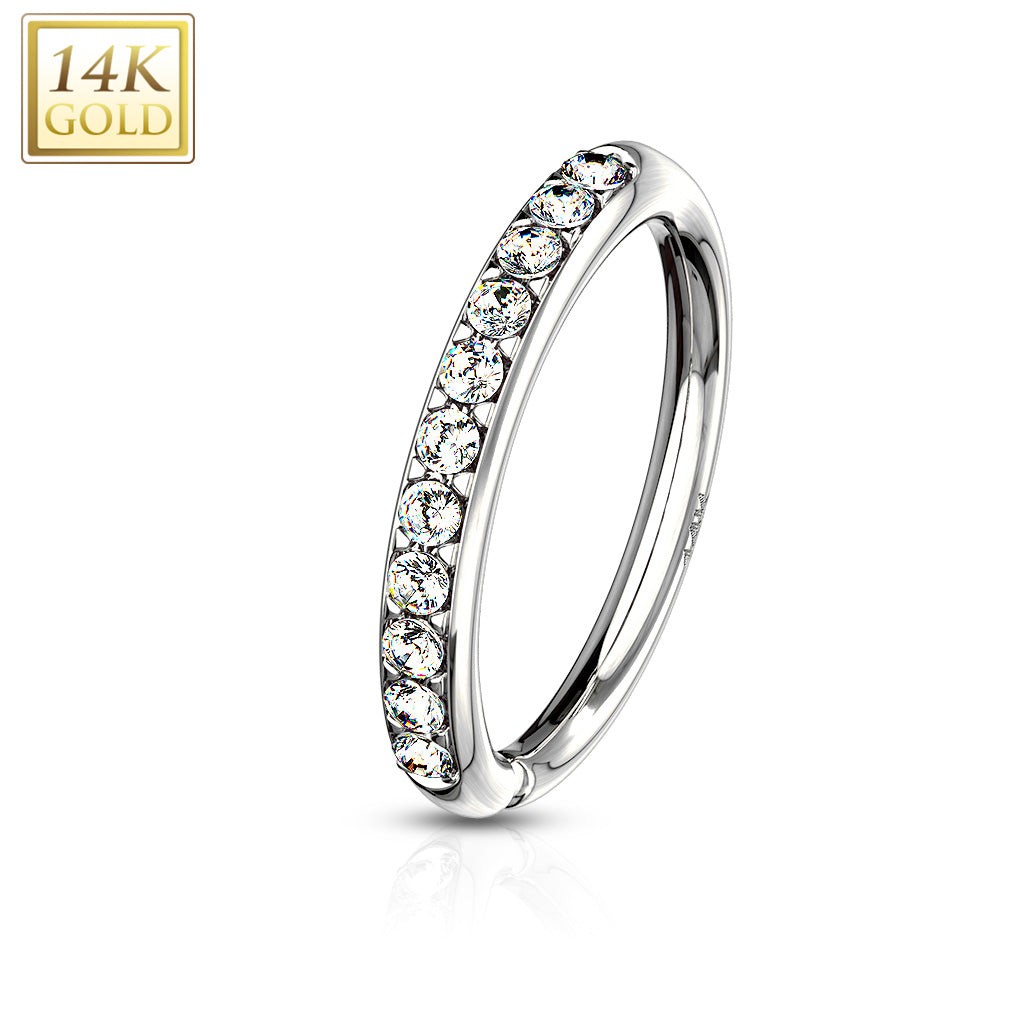 14 karat gold bendable gold nose hoop with prong-set cz gems. Just twist open to put in nostril, and twist back to line it up. Shown in white gold. 20 gauge X 8mm. Autoclave not recommended.