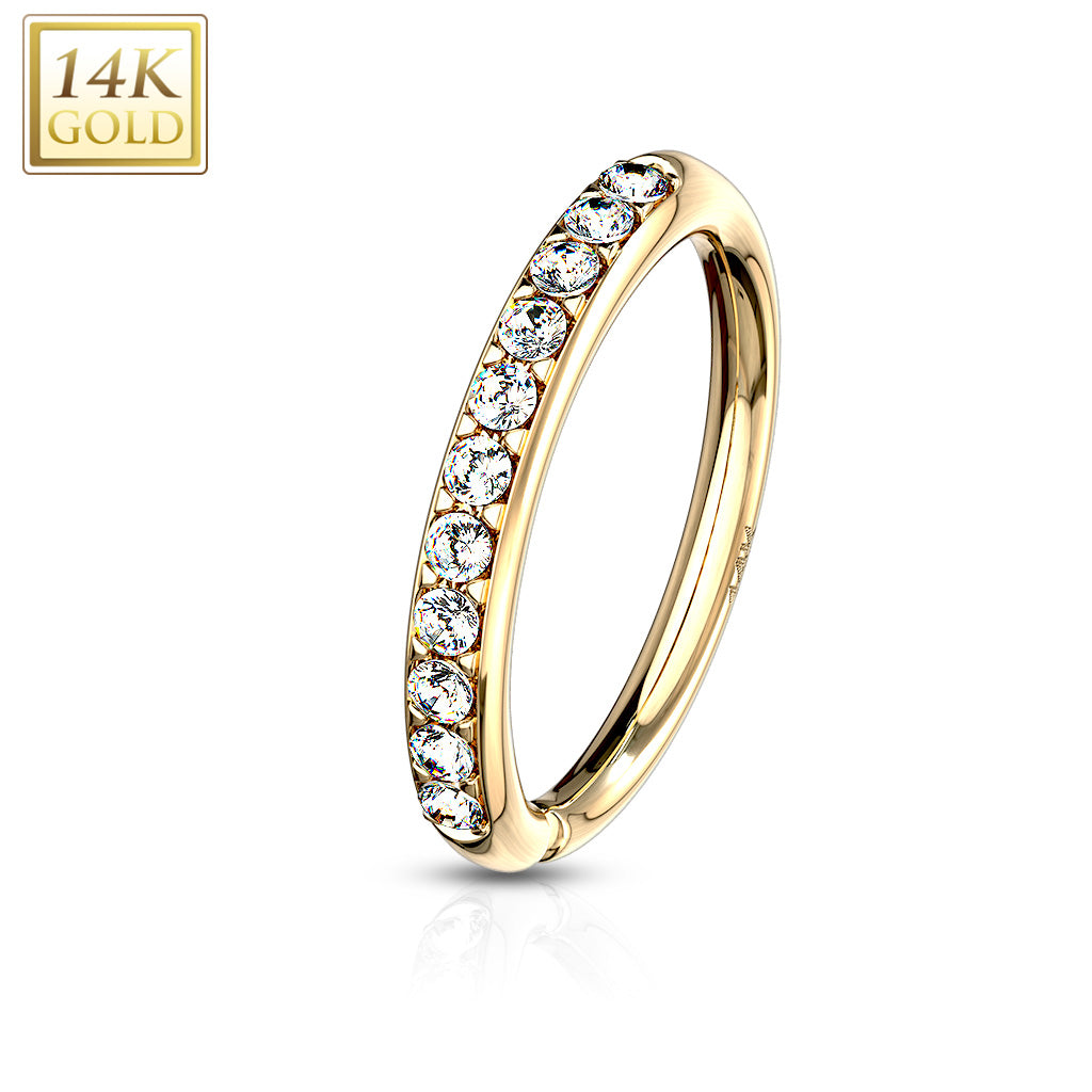 14 karat gold bendable gold nose hoop with prong-set cz gems. Just twist open to put in nostril, and twist back to line it up. Shown in yellow gold. 20 gauge X 8mm. Autoclave not recommended.