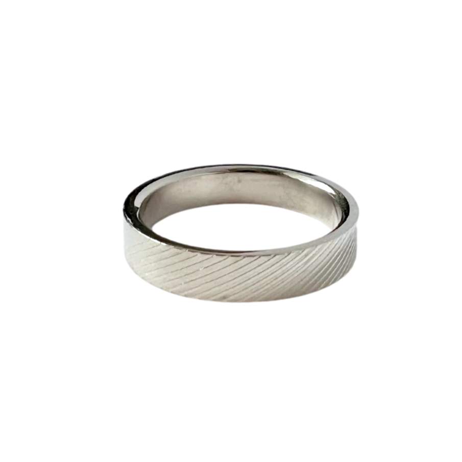 Thin stainless steel band with diagonal stripe embossed all the way around.