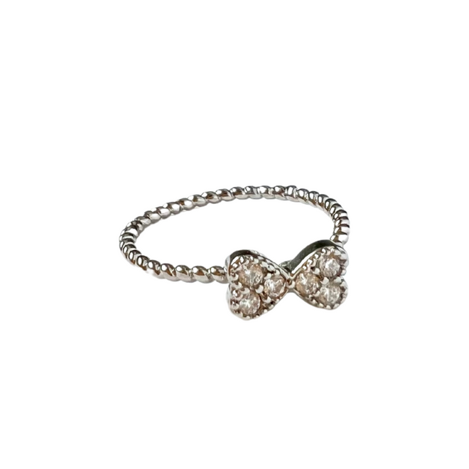 Stainless steel ring with a dainty bow made of cubic zirconias.
