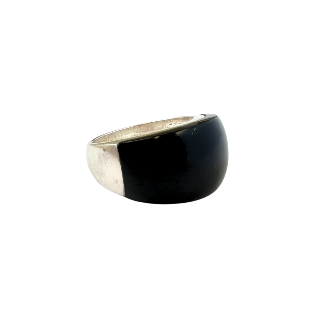 Sterling silver ring with black onyx in the middle.