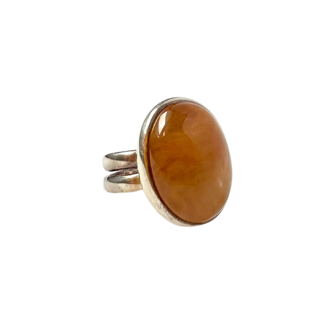 Sterling silver double band ring with an oval tan cabochon gemstone.