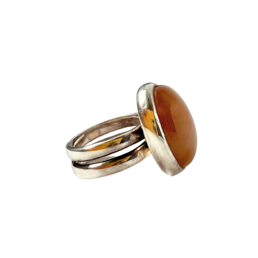 Sterling silver double band ring with an oval tan cabochon gemstone.