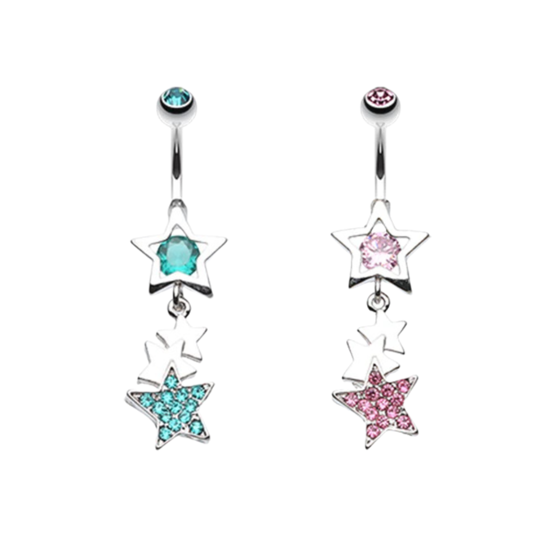 Two surgical steel dangling belly rings with open star designs, featuring teal blue and light pink crystal centers with matching pave-set trailing stars on a white background.