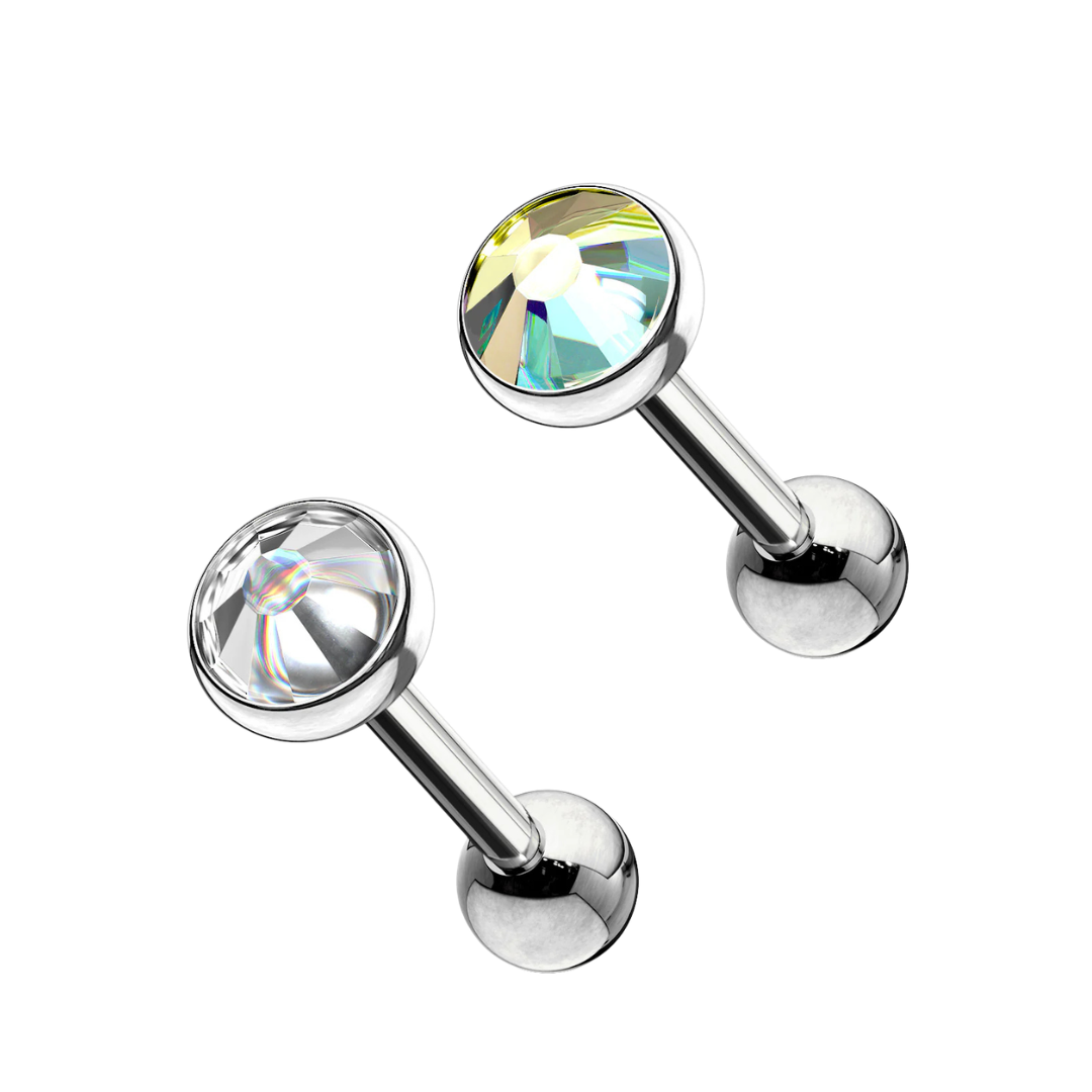 Two surgical steel barbell stud earrings featuring round bezel-set gemstones, one with an iridescent Aurora Borealis finish and one with a clear crystal, on a white background.