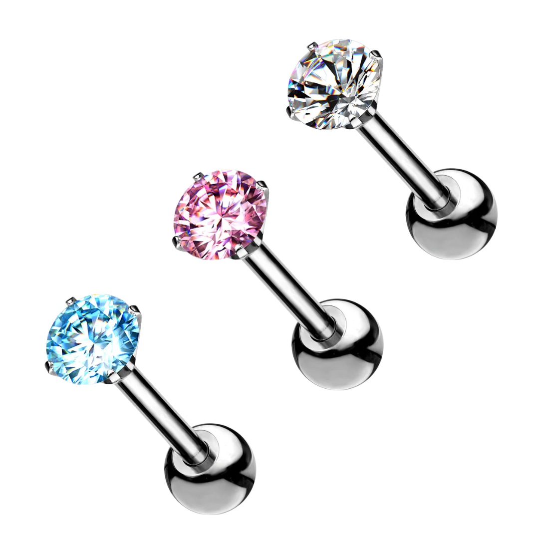 Three titanium labret stud earrings on a plain white background, each with a round gemstone set in a silver-toned post and ball back. The stones are shown in three colorways: clear, light blue, pink, and clear.