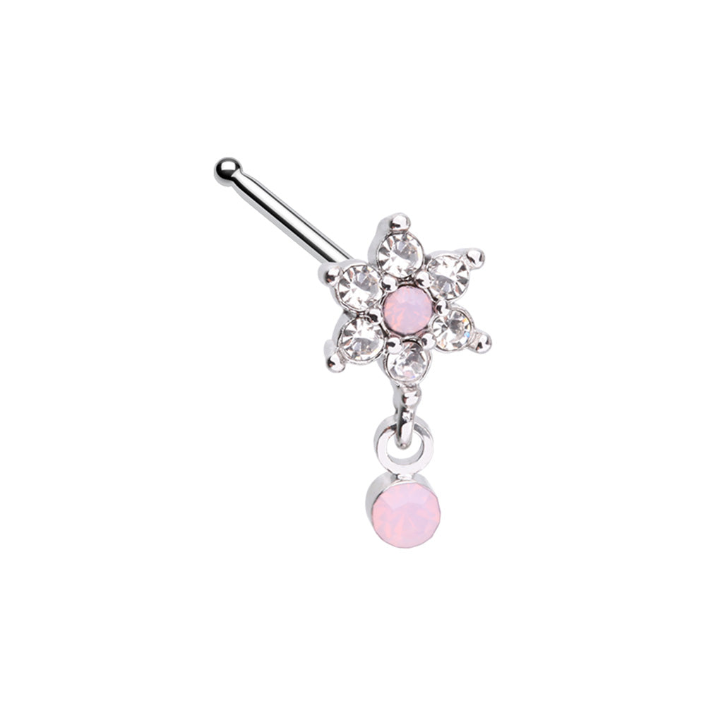 Surgical steel straight nose bone piercing featuring a six-petal flower charm encrusted with clear cubic zirconia, a pink center stone and a matching dangling pink opal accent.