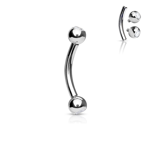 Implant grade titanium curved barbell with press set clear gems in each ball.  Internally threaded. These basic curved barbells are perfect for eyebrow, rook or daith. Ti-6AL4V-ELi ASTM F-136 TITANIUM.