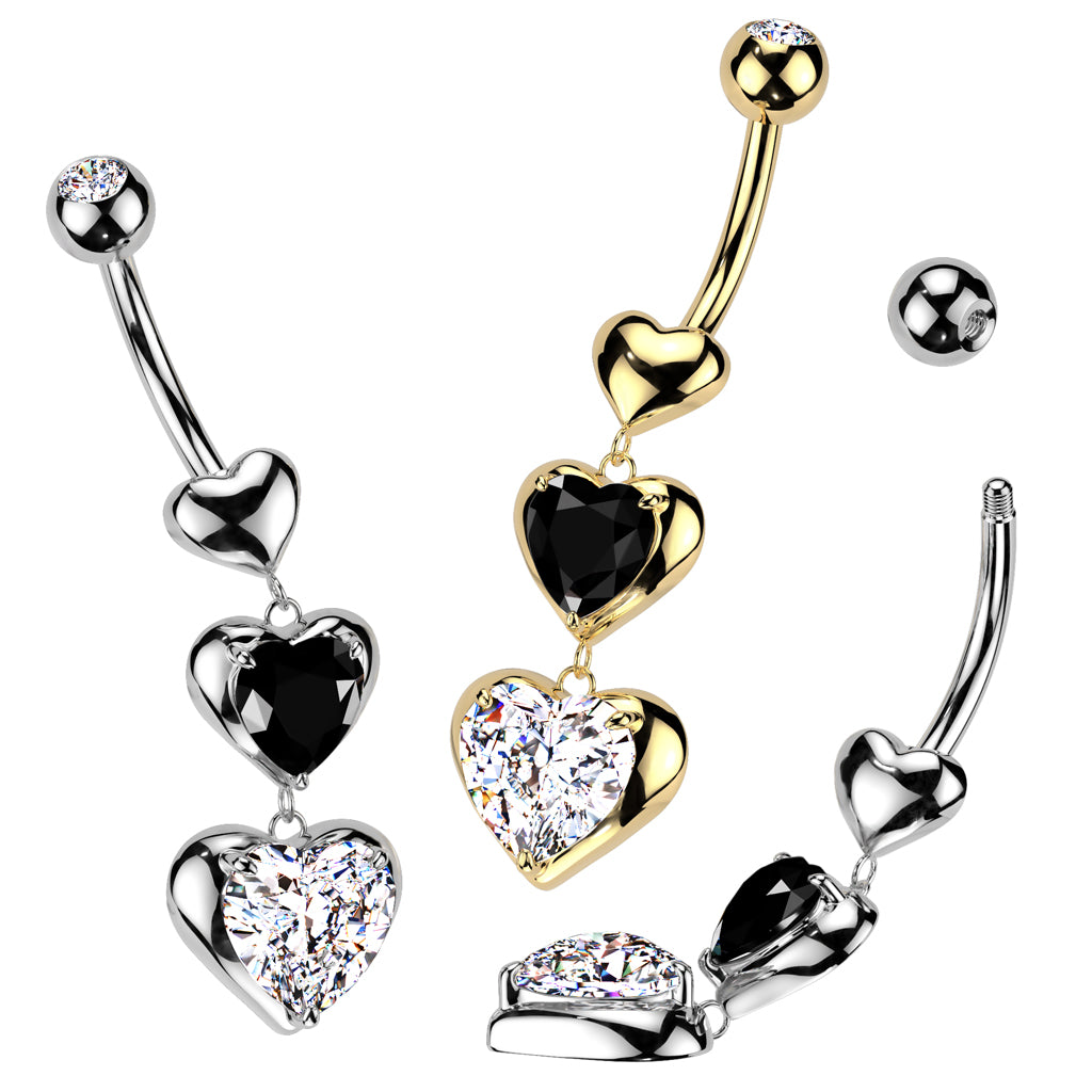 A gold plated and two stainless steel belly button ring with a dangling triple heart design featuring black and clear crystals.