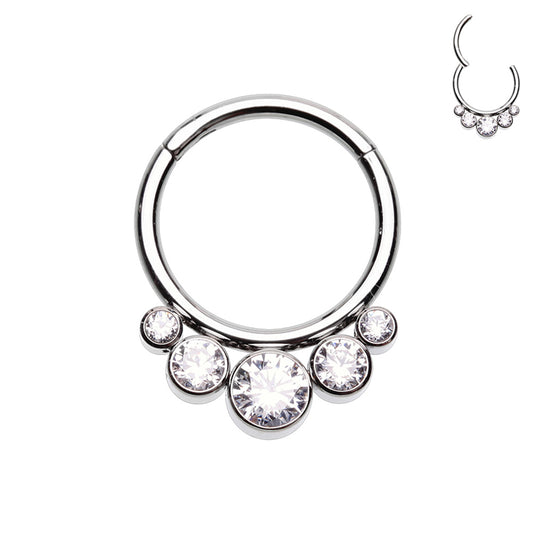 Elegant hinged segment clicker. 316L Surgical steel with 5 clear gems from cascading small gems to a larger middle gem. The rounded top of this hinged clicker makes it a great piece of jewellery for septum, daith, tragus, or rook piercings.