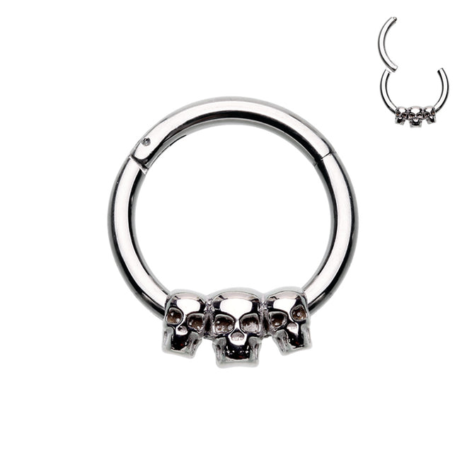 316L Surgical steel hinged segment ring with 3 small skulls in steel. Great for septum or cartilage.  These hinged clickers can be used for eyebrow, lip, earlobes, daith, rook, snug, helix or septum.  