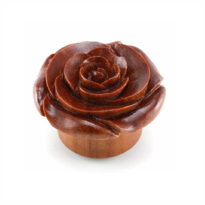 Side view of arang wood plug with a gorgeous carved rose flower. 