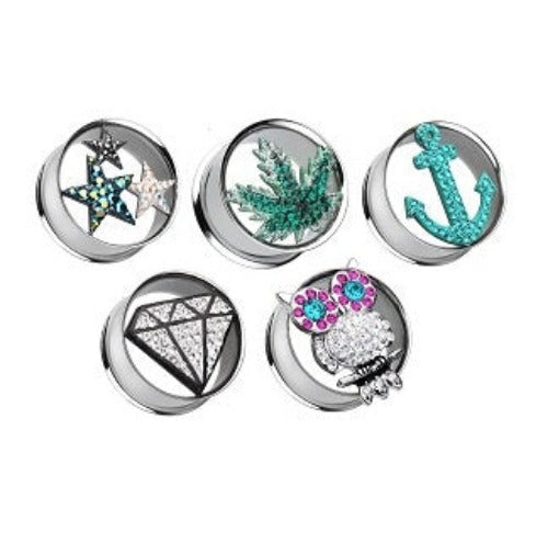 A collection of 316L surgical steel double flare tunnels with various jewelled designs, including stars, a diamond, an anchor, and an owl.