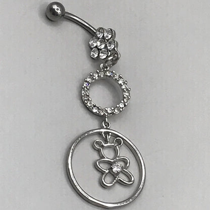 Cute surgical steel belly ring with a bottom gem shaped flower and a dangly small gem covered circle and a bear with a centre gem in a larger circle. Externally Threaded. Shown with clear gems.