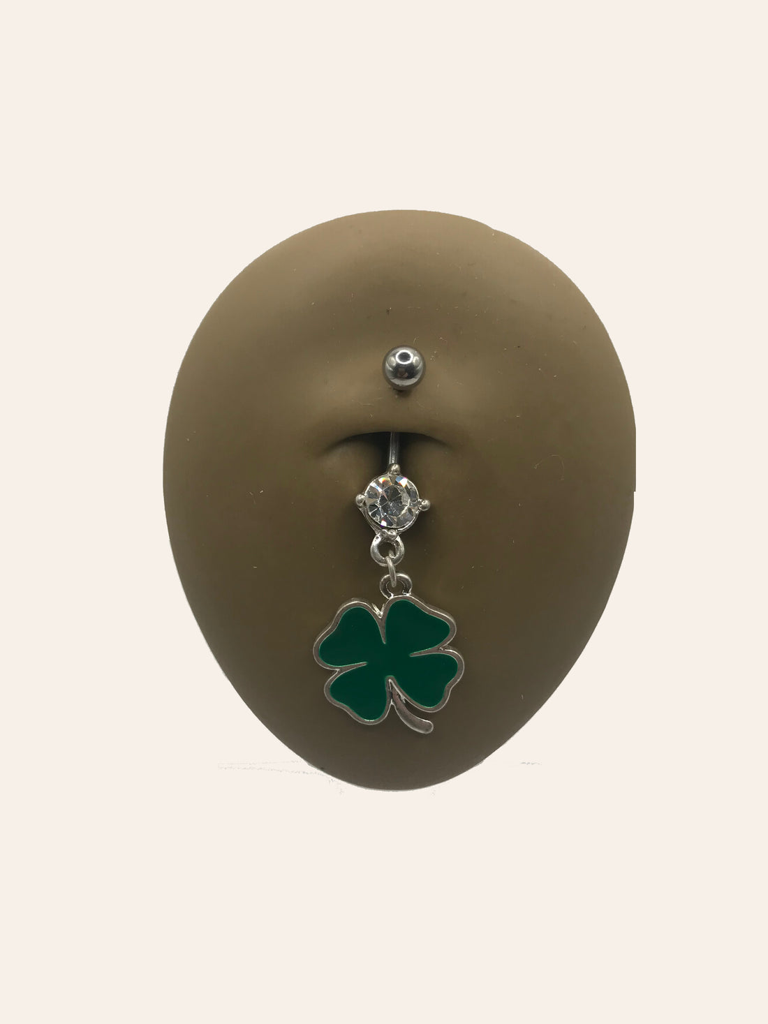 Clover-themed belly button ring features a dangling green four-leaf clover charm and a small cz gem