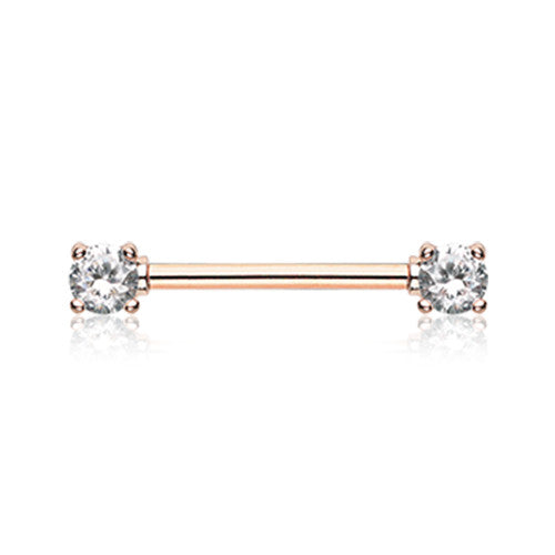 A rose gold nipple barbell rings featuring clear prong-set cubic zirconia gems