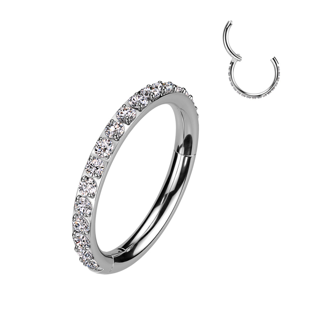Titanium hinged segment ring with clear side-facing cubic zirconias. Great for cartilage piercings, lip, eyebrow, ear lobes, or even nostril. These beautiful jewelled clickers look great in the daith, rook, snug, helix or tragus. Three diameters are available, 8mm, 10mm, or 12mm so you can choose a snug fit, or a bigger ring for more space.