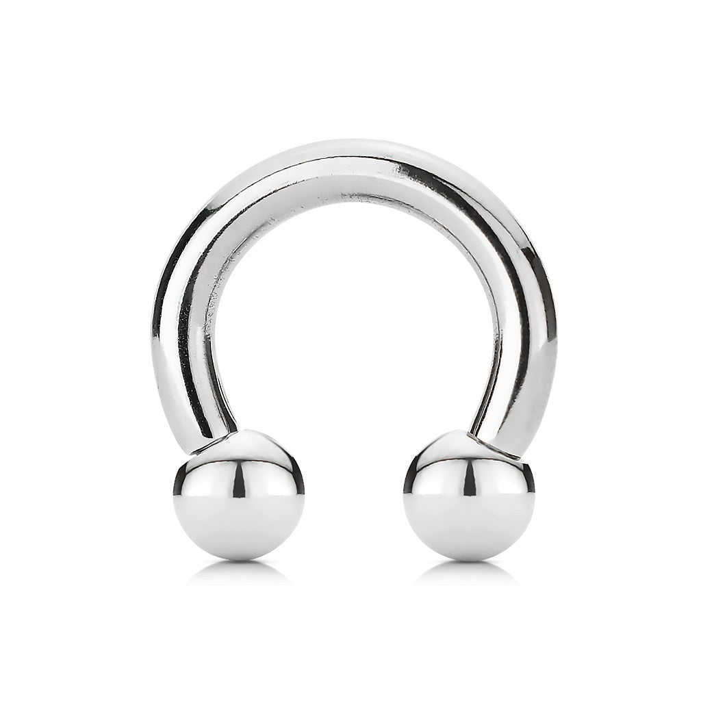 A high-polished silver surgical steel circular horseshoe barbells featuring two polished ball ends.