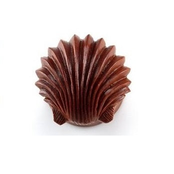 A craft wooden shell-shaped plug.