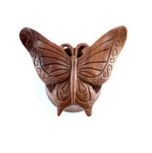 Carved wooden butterfly-shaped double flare tunnel.