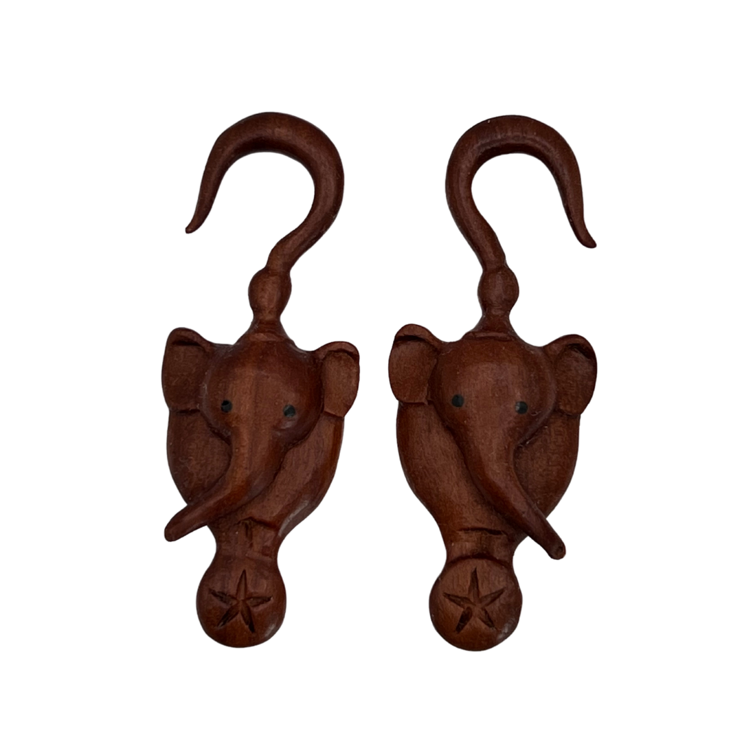 Sabo wood carved elephant hangers. These elephants have one RIGHT facing and one LEFT facing.  Unlike our other stretchers, these stretchers are sold by the PAIR.
