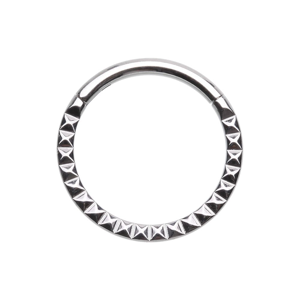 Hinged segment clicker. 316L Surgical steel with angled cut design that catches the light. The rounded top of this hinged clicker makes it a great piece of jewellery for septum, daith, tragus, or rook piercings.