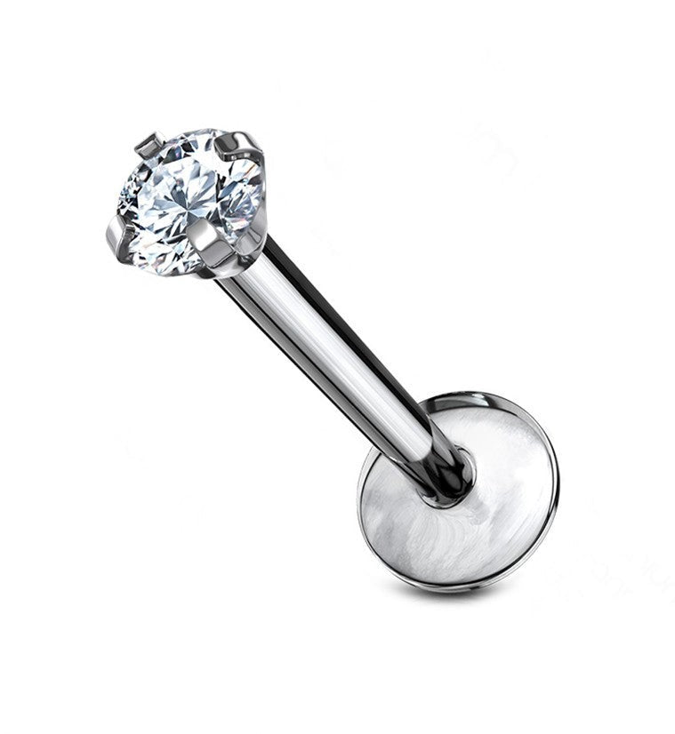 A surgical stainless steel labret stud featuring a prong-set clear zircon crystal and a flat back.