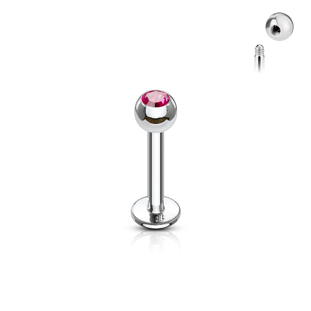a surgical stainless steel labret stud featuring a fuschia gem ball end