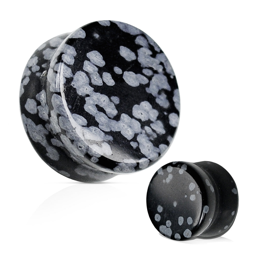 A pair of snowflake obsidian double flared plugs for ear tunnels, showing a black and gray color pattern.