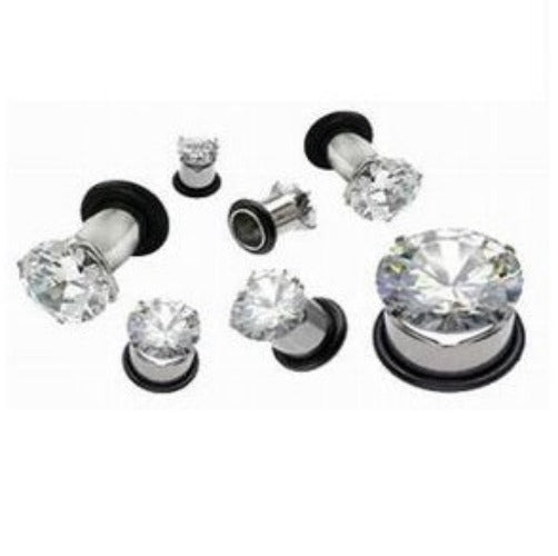 Sterling steel ear plugs featuring a large clear prong-set cubic zirconia gem