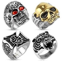 Stainless steel biker rings in assorted designs, often available in trays containing various sizes.