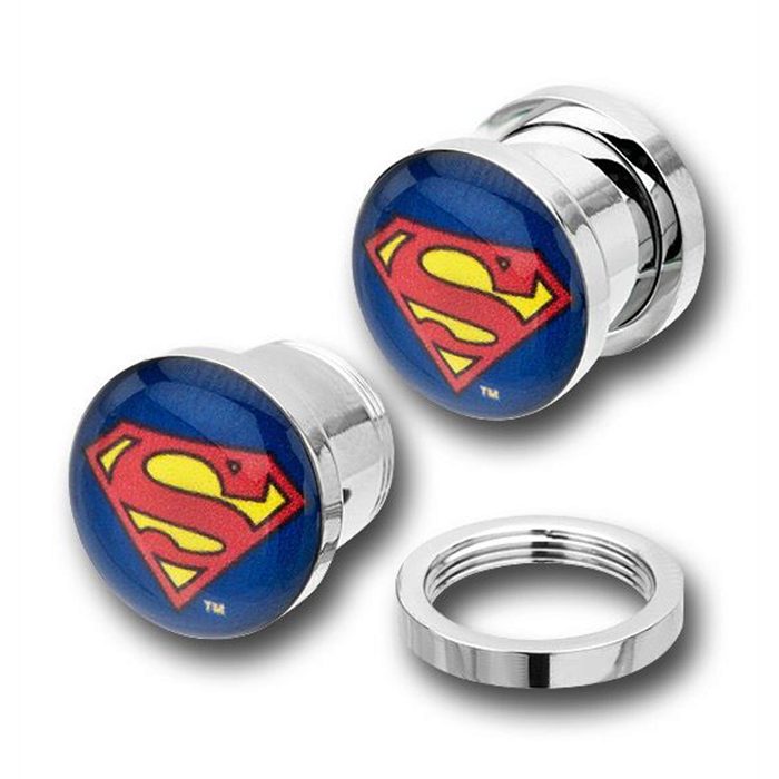 A pair of silver-colored ear plugs featuring the Superman logo in blue and red.